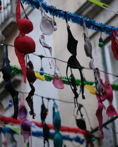 a bunch of bras hanging from a wire