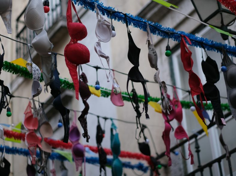 a bunch of bras hanging from a wire